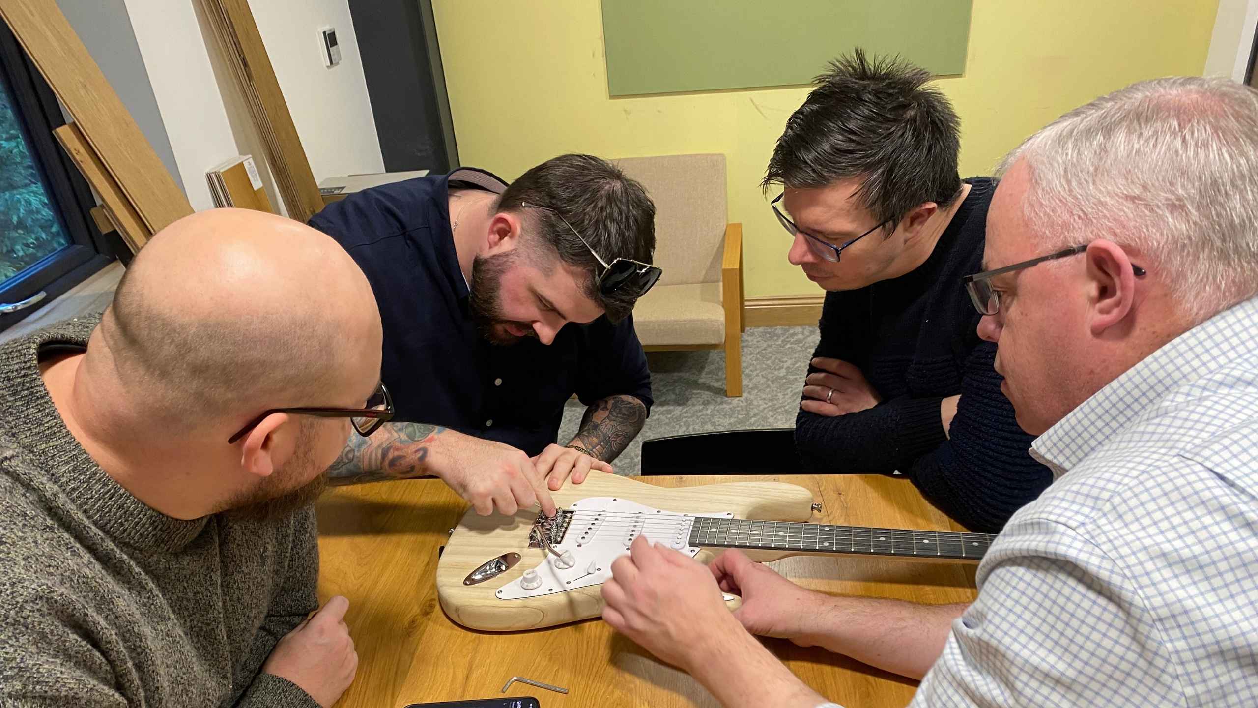 Charity guitar build team building